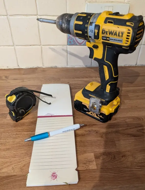 Handyman checking off home maintenance tasks on a clipboard